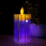 Vela de movimiento realista de luz cálida y base multicolor